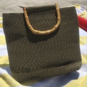A brown tan brown personal beach bag